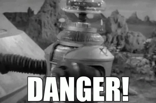 Lost in Space robot waving its arms with the word Danger